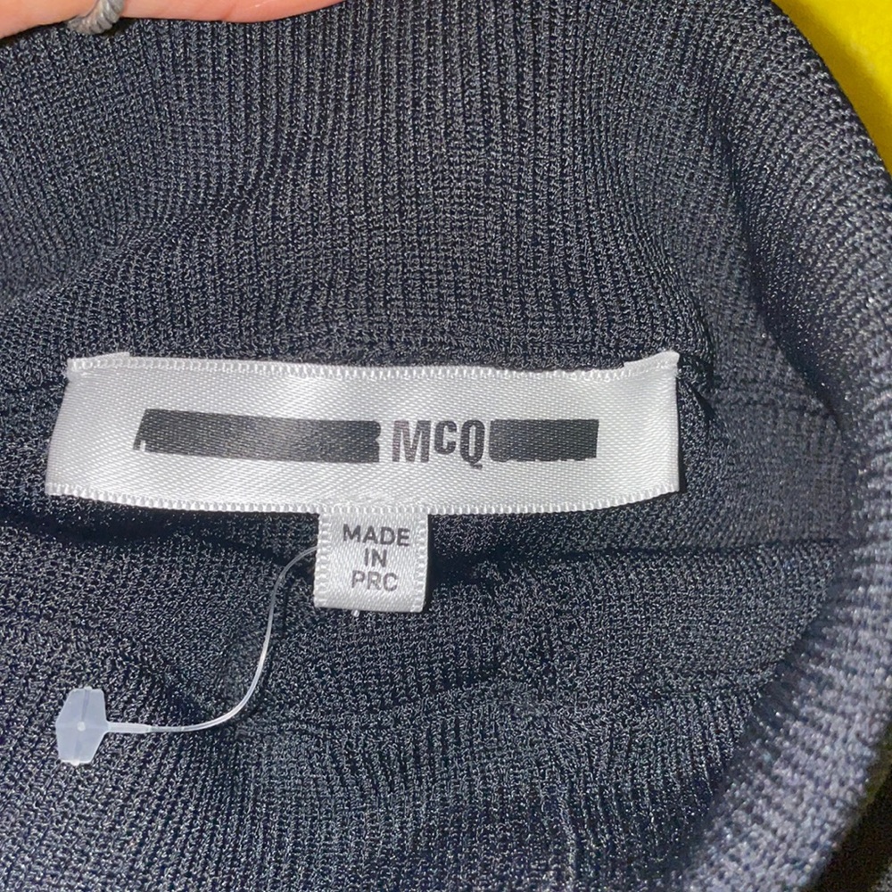 Black McQueen skirt. Has detailed lines.